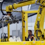 Top Amazon exec says it's a ‘myth' robots steal jobs